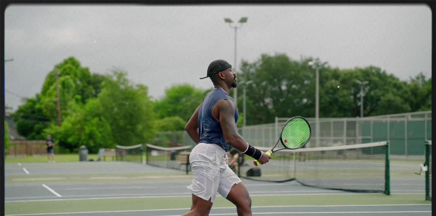 An adult player in match play on a Houston court